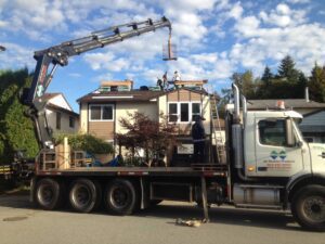 A truck with a crane on the back of it.