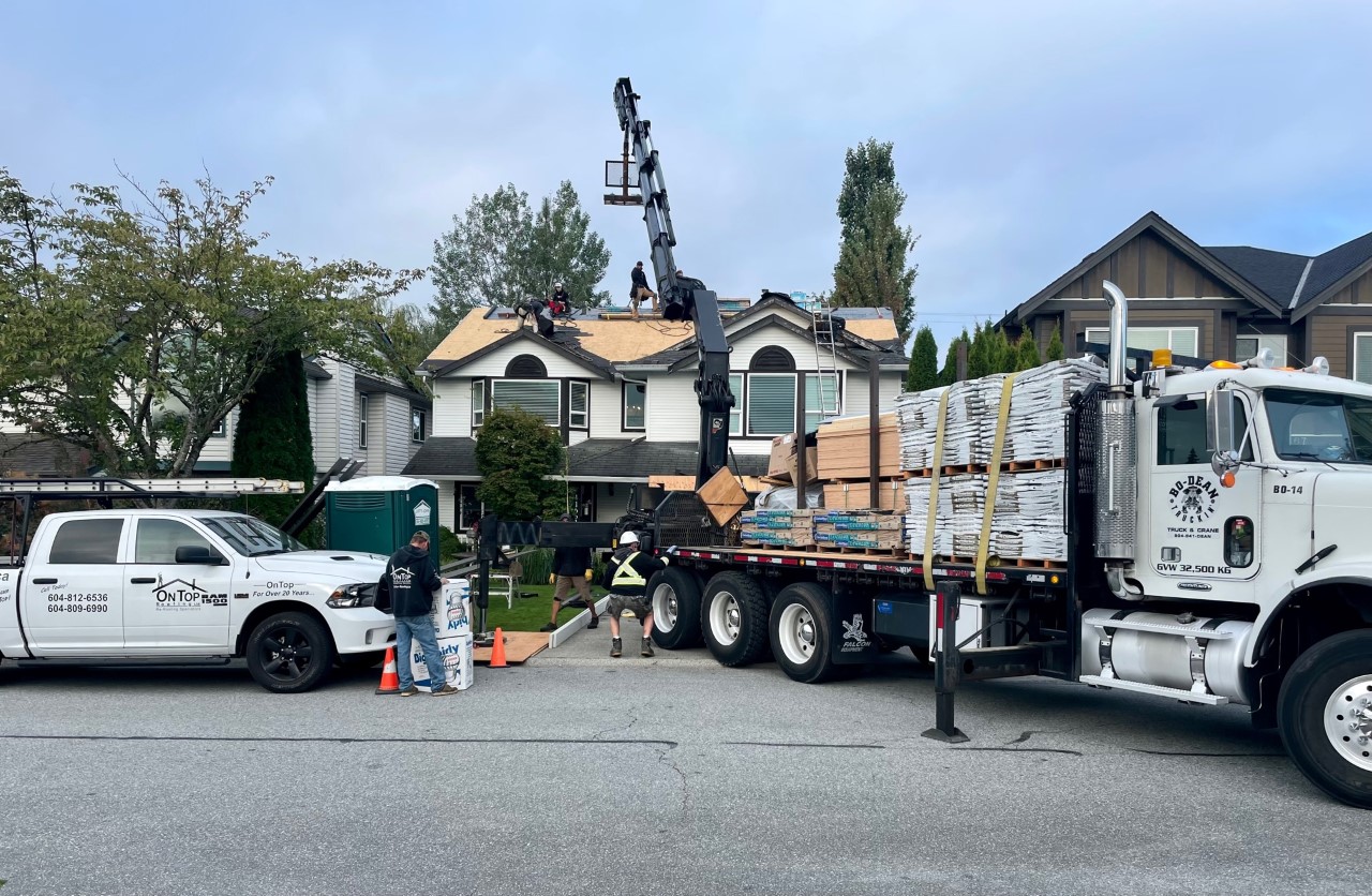 Roofing materials on the truck and the on top vehicle